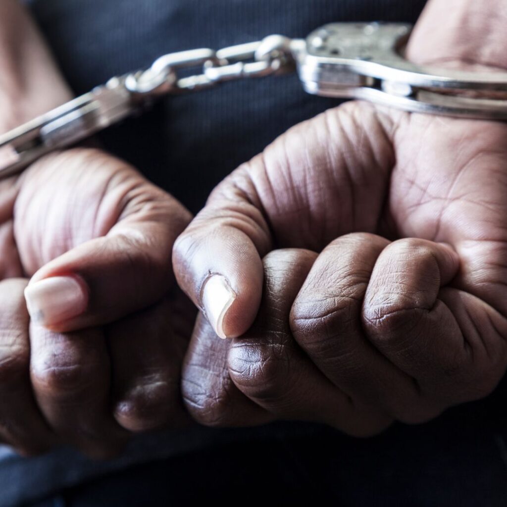 person in handcuffs