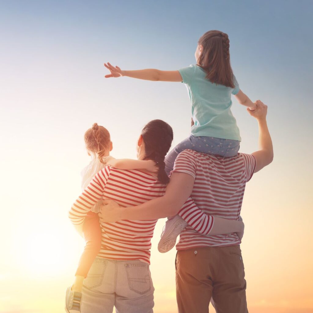 a happy family at sunset